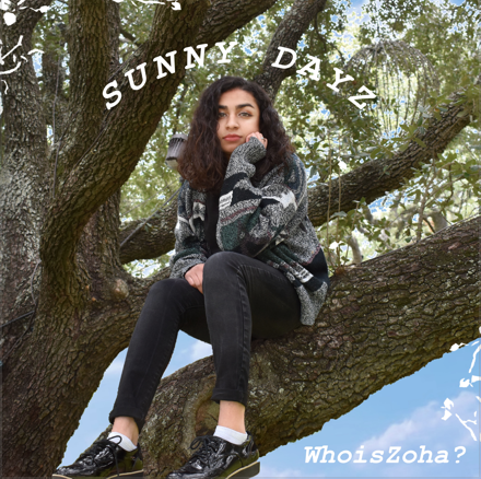 A woman is sitting on a tree branch with the words sunny dayz