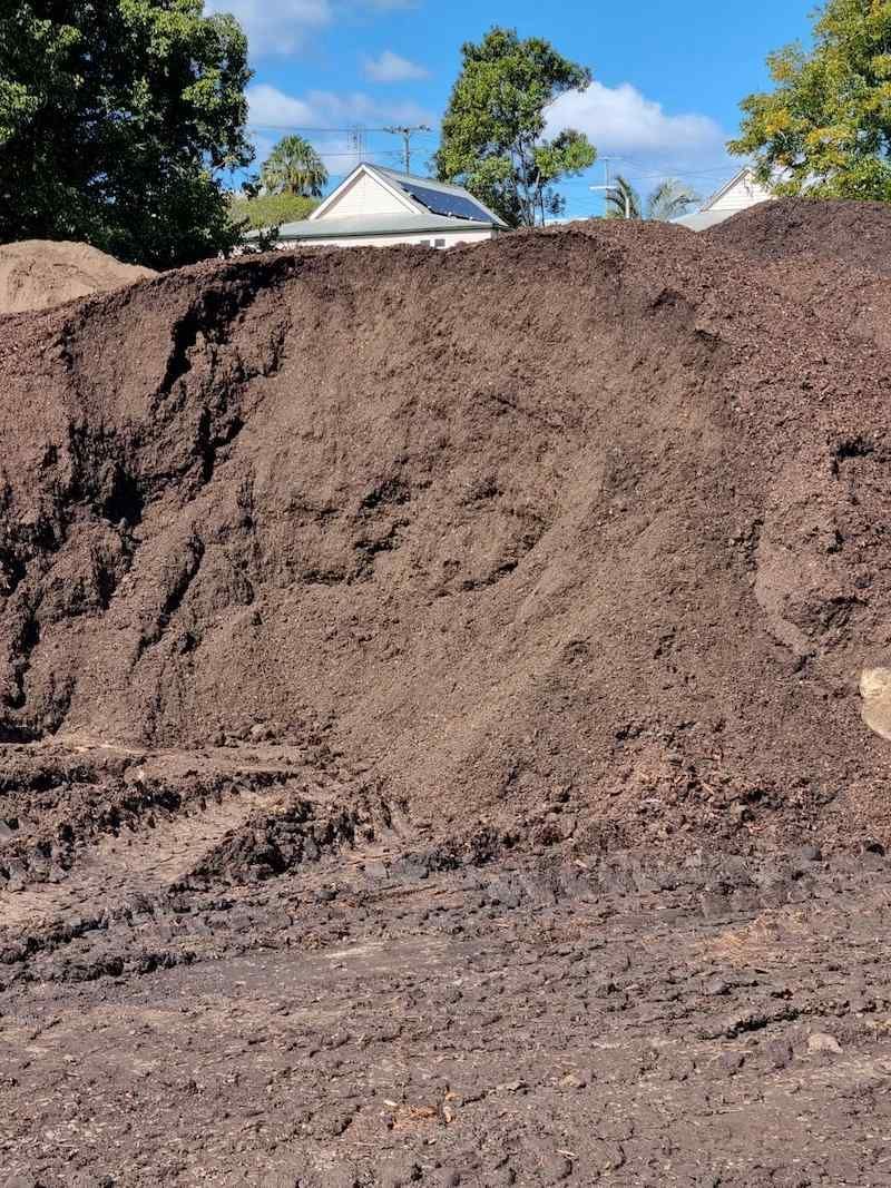 There Is A Large Pile Of Dirt In The Middle Of A Field — Campbell's Truck and Bobcat and Landscape Supplies In Gympie, QLD
