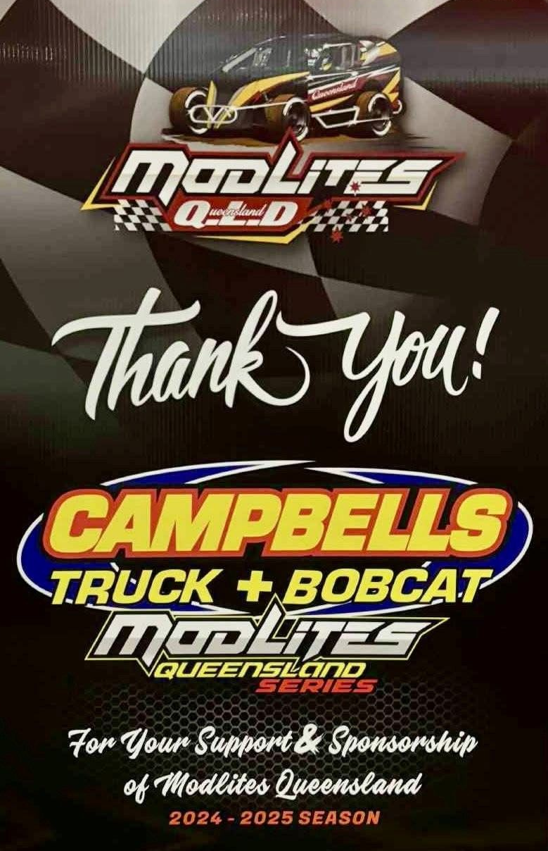 A white dump truck is parked in a dirt lot.