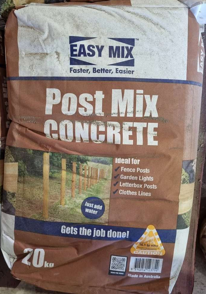 A Bag Of Easy Mix Post Mix Concrete Is Sitting On A Table — Campbell's Truck and Bobcat and Landscape Supplies In Gympie, QLD