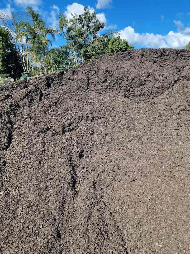 A Large Pile Of Dirt Is Sitting On Top Of A Hill — Campbell's Truck and Bobcat and Landscape Supplies In Gympie, QLD