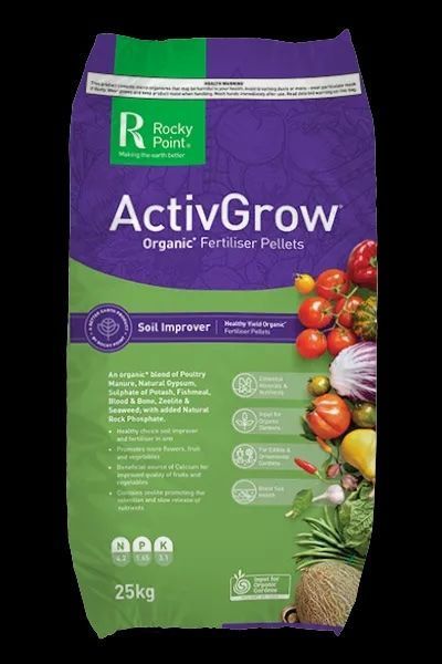 Boxes of sugar cane mulch are stacked on top of each other on a pallet.