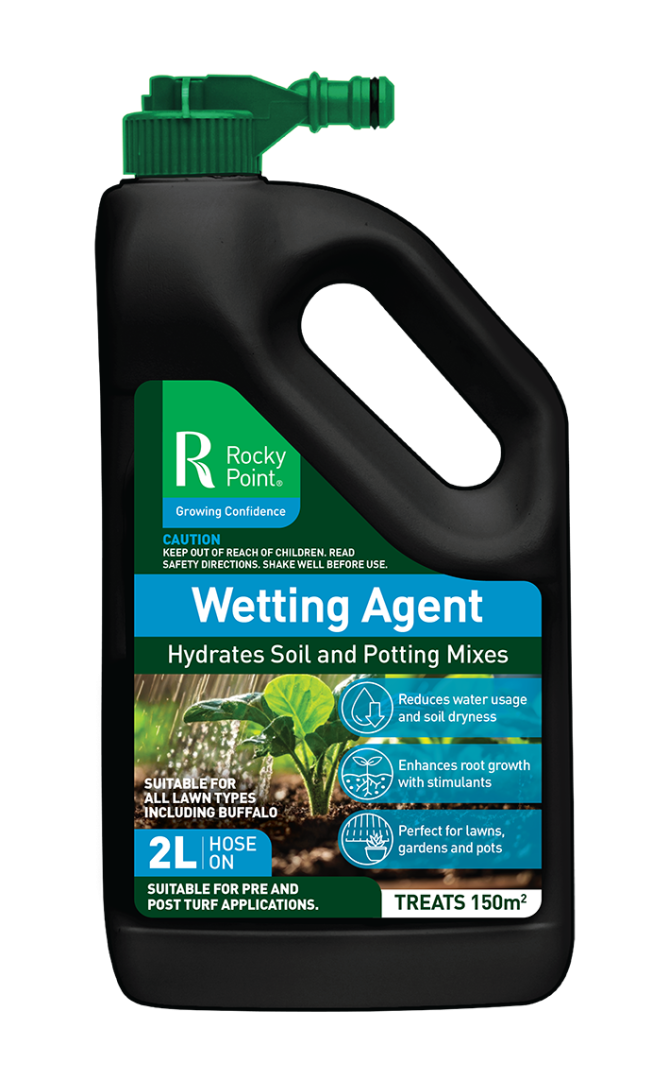 A bottle of wetting agent with a hose attached to it.