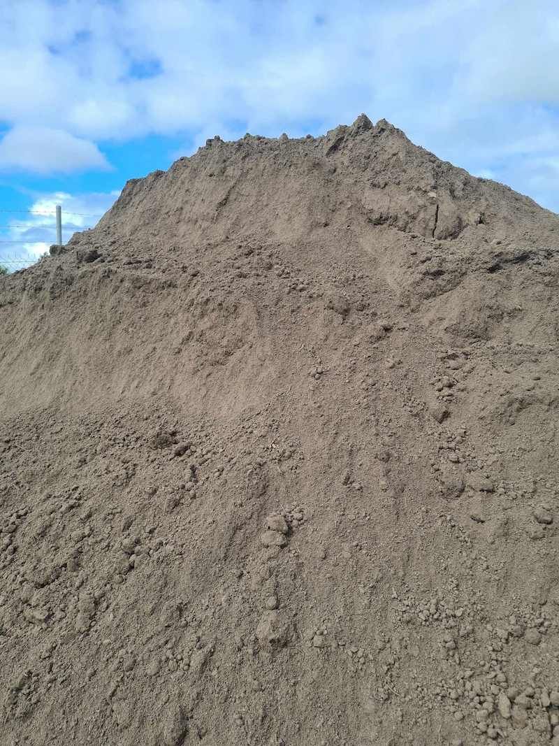 A Pile Of Dirt Is Sitting On Top Of A Hill — Campbell's Truck and Bobcat and Landscape Supplies In Gympie, QLD