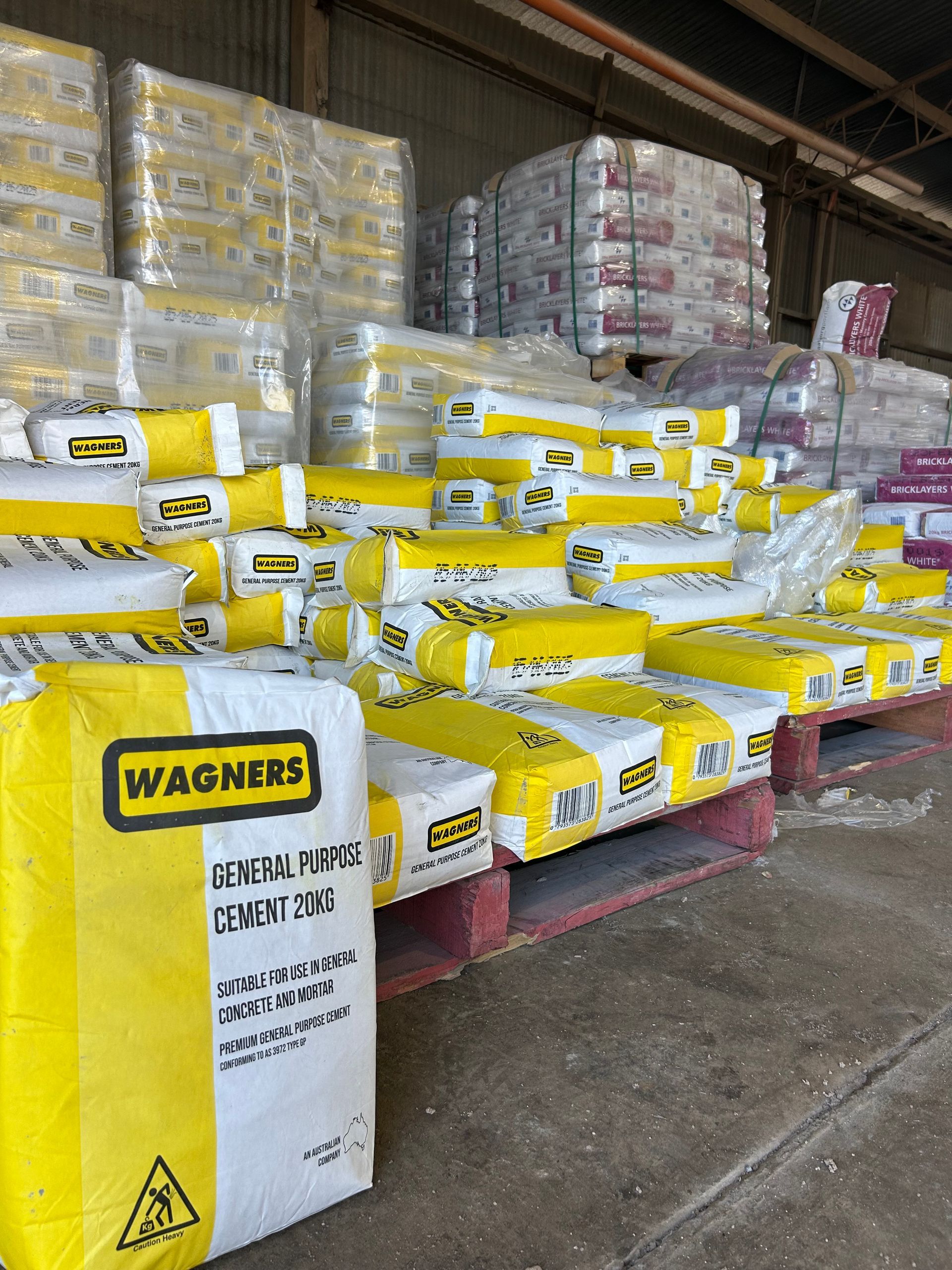 A Bunch of Bags of Cement Are Stacked on Top — Campbell's Truck and Bobcat and Landscape Supplies In Gympie, QLD
