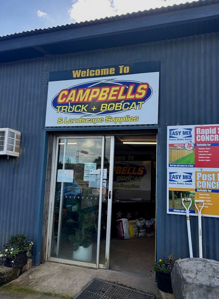 A Car is Parked in Front of a Building — Campbell's Truck and Bobcat and Landscape Supplies In Gympie, QLD