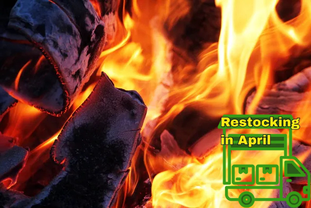 Burning wood fire with orange and yellow flames, with 