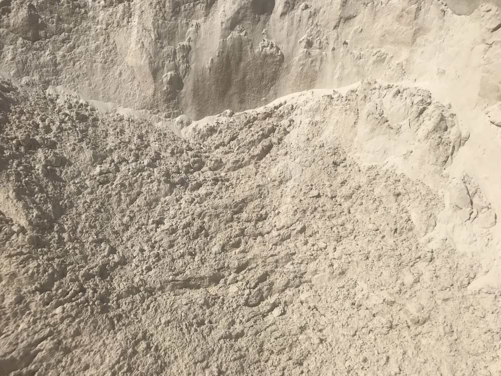 A Pile Of White Sand Is Sitting On Top Of A Pile Of Dirt — Campbell's Truck and Bobcat and Landscape Supplies In Gympie, QLD