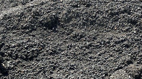 Gravel pile; dark gray, small, irregularly shaped stones. — Campbell's Truck and Bobcat and Landscape Supplies In Gympie, QLD