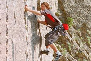 man rock climbing