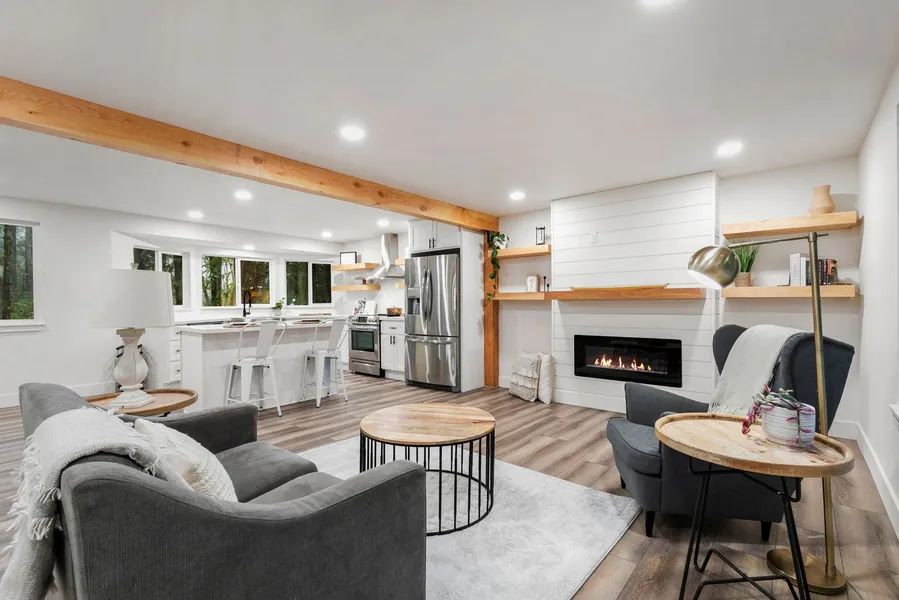 A living room filled with furniture and a fireplace.