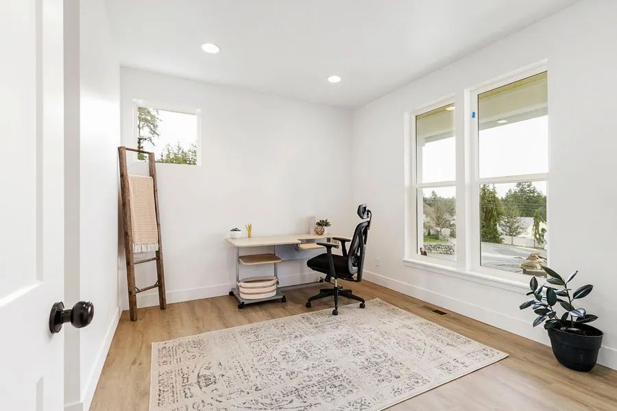 There is a desk and chair in the room.