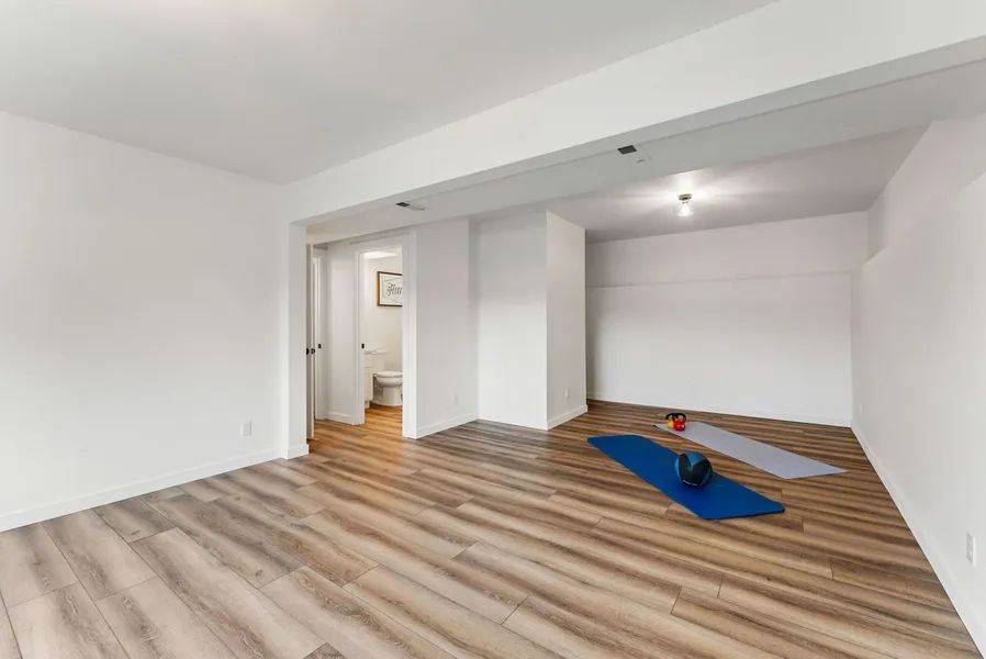 There is a yoga mat in the middle of the room.