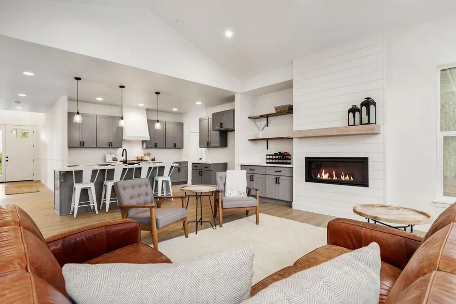 A living room filled with furniture and a fireplace.