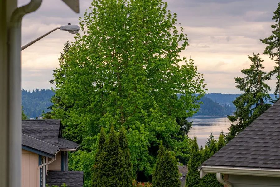 A view of a lake from a porch of a house.