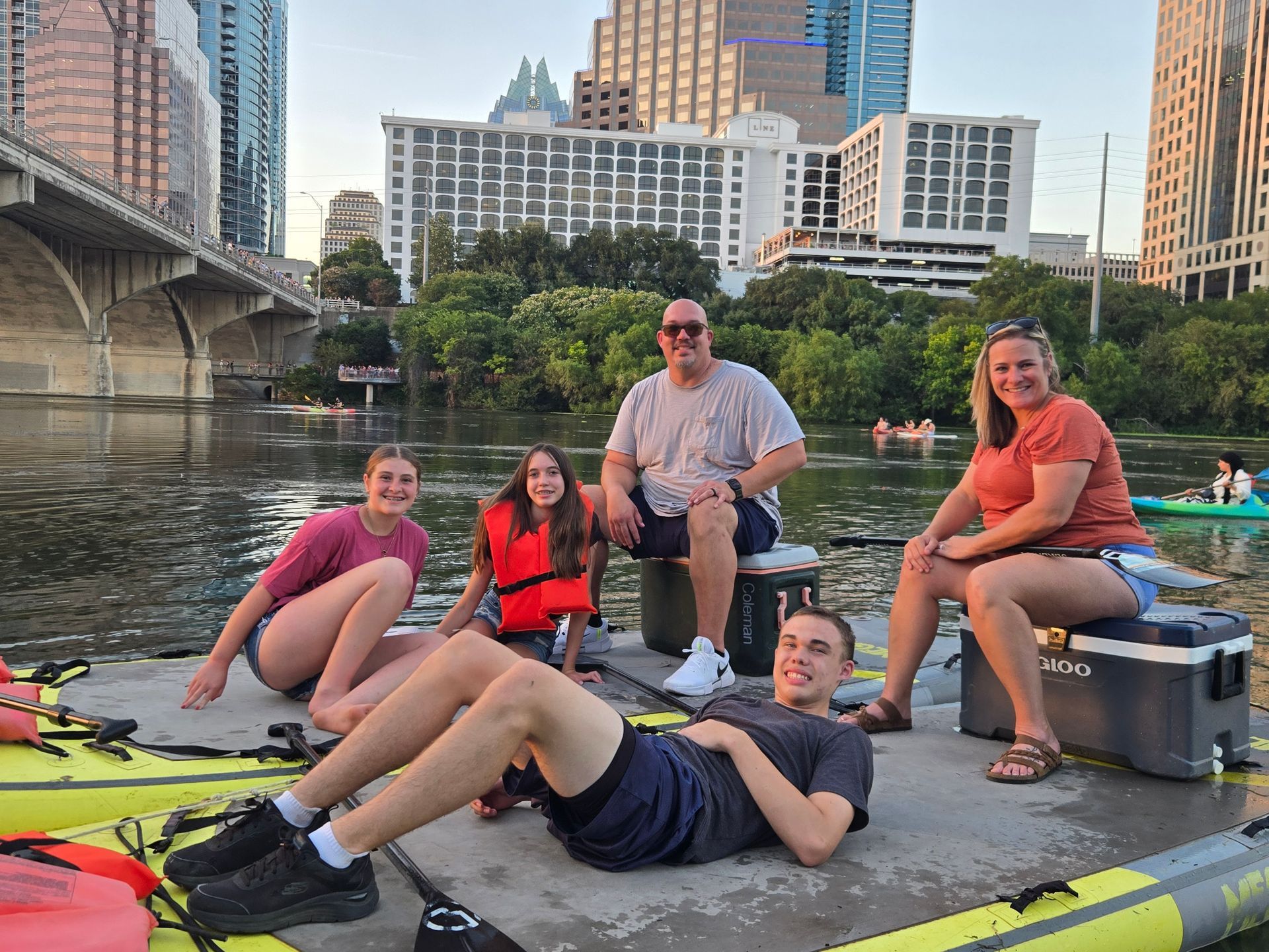 Family paddleboarding on Lady Bird Lake in Austin Texas