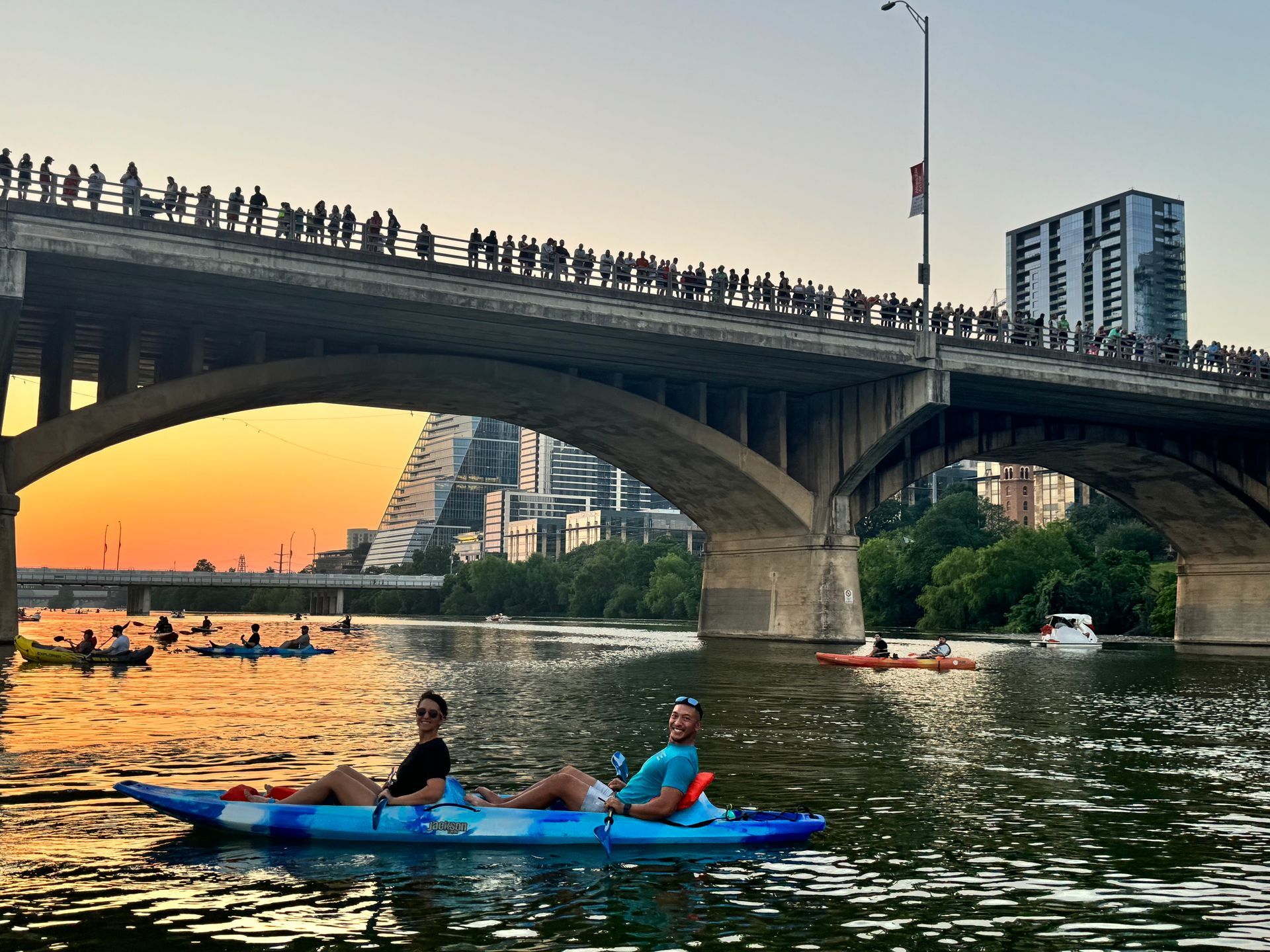 Peaceful people on a kayak at sunset on Lady Bird Lake.