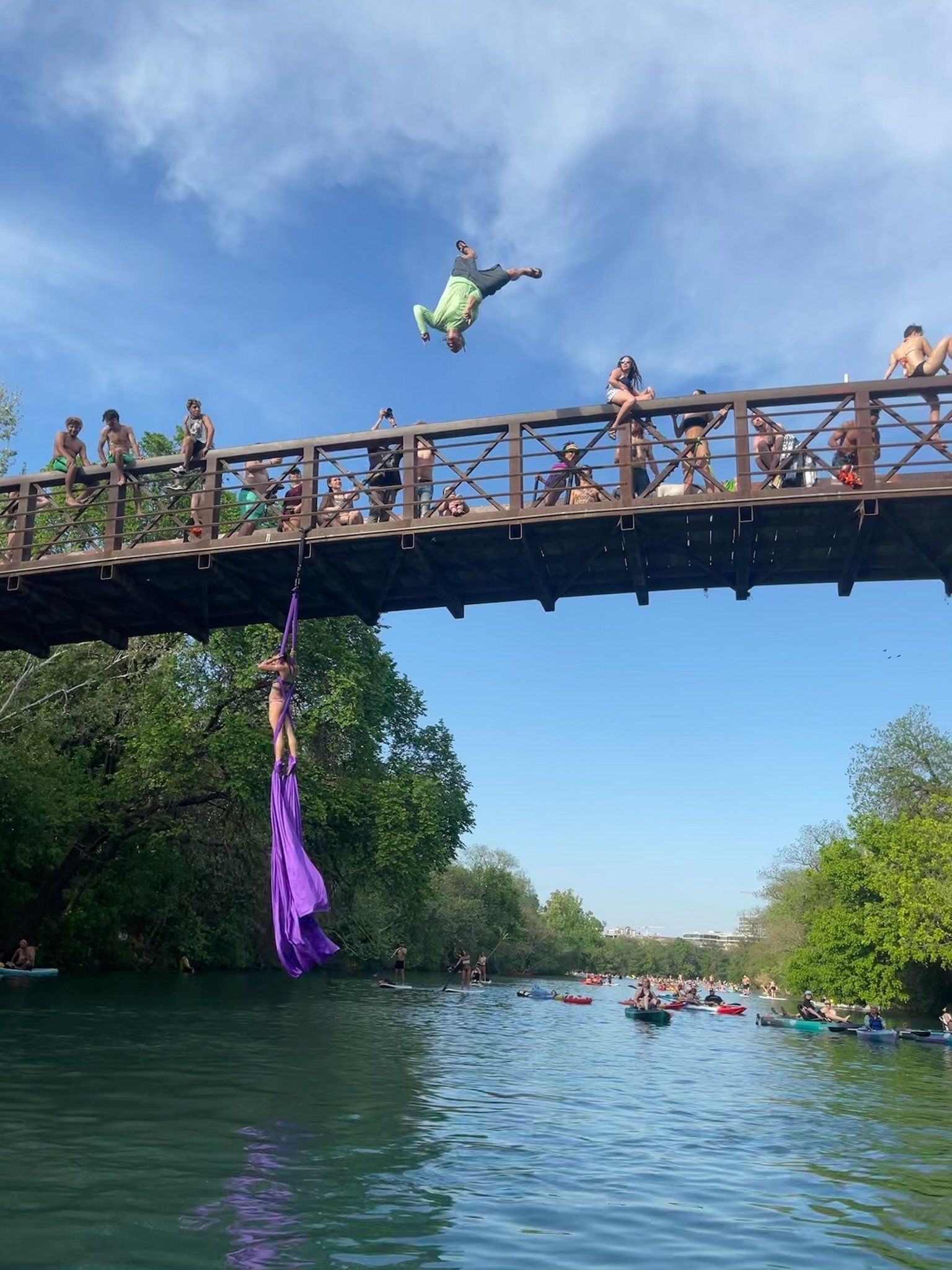 A group of people are floating on rafts in the water