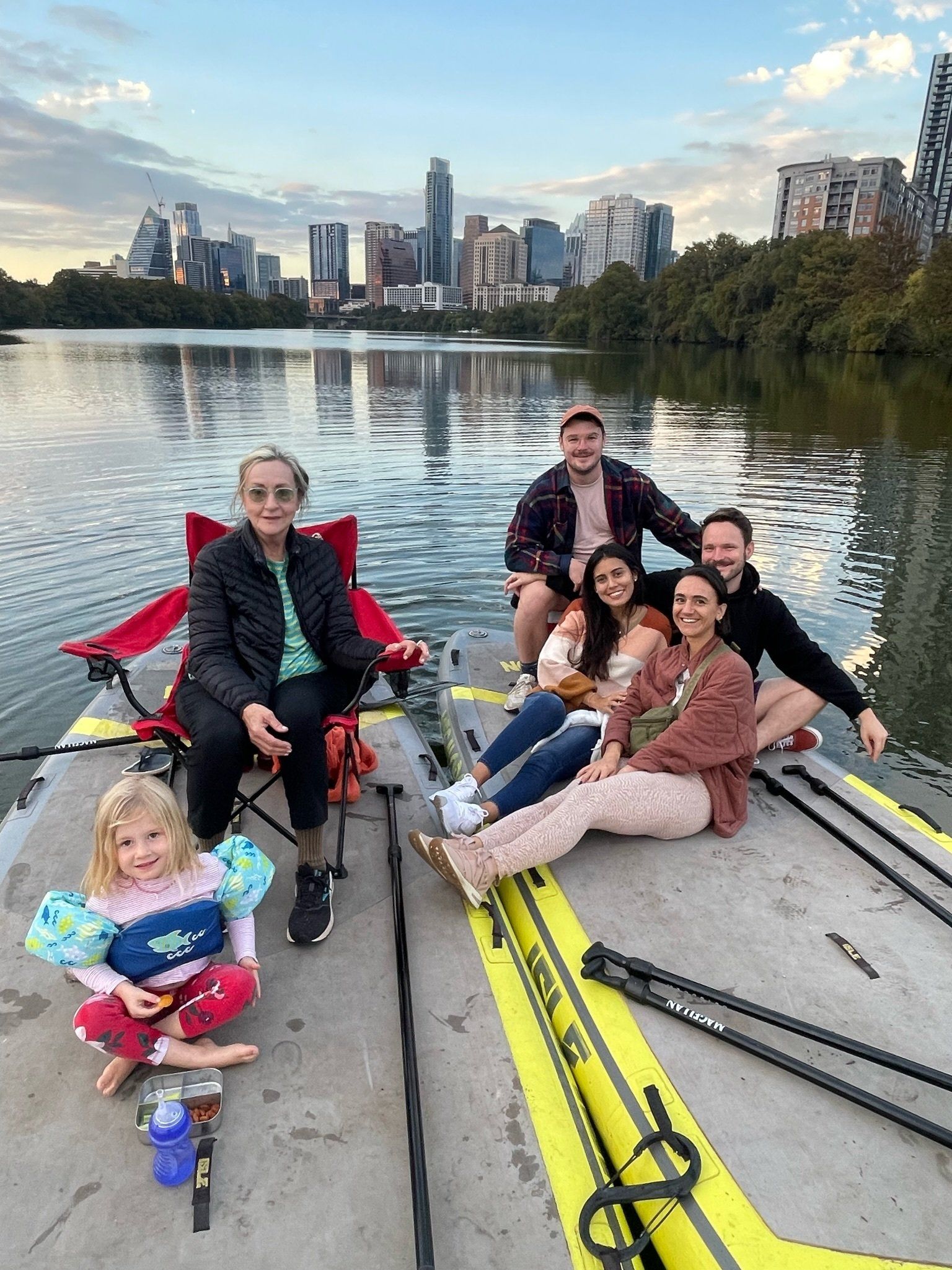 family on the giant paddle board tour with boats and bats in austin, tx