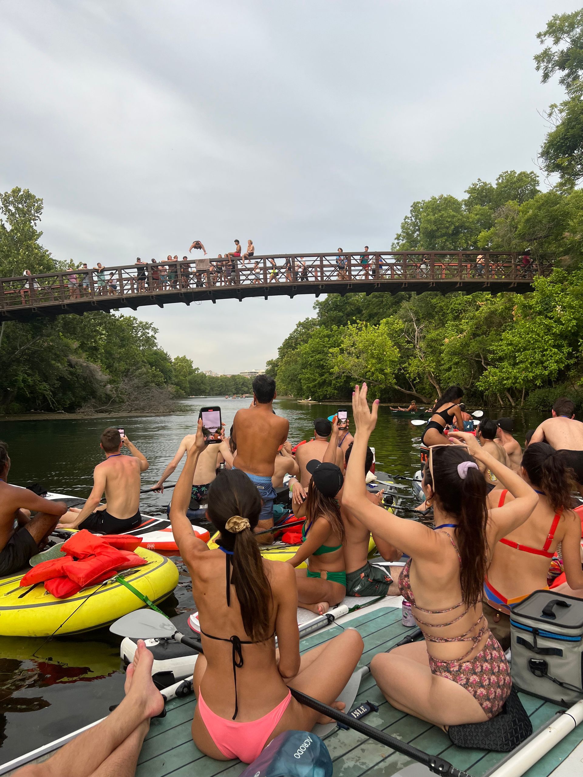 Paddler taking a selfie on Lady Bird Lake, with the Austin skyline in the background.