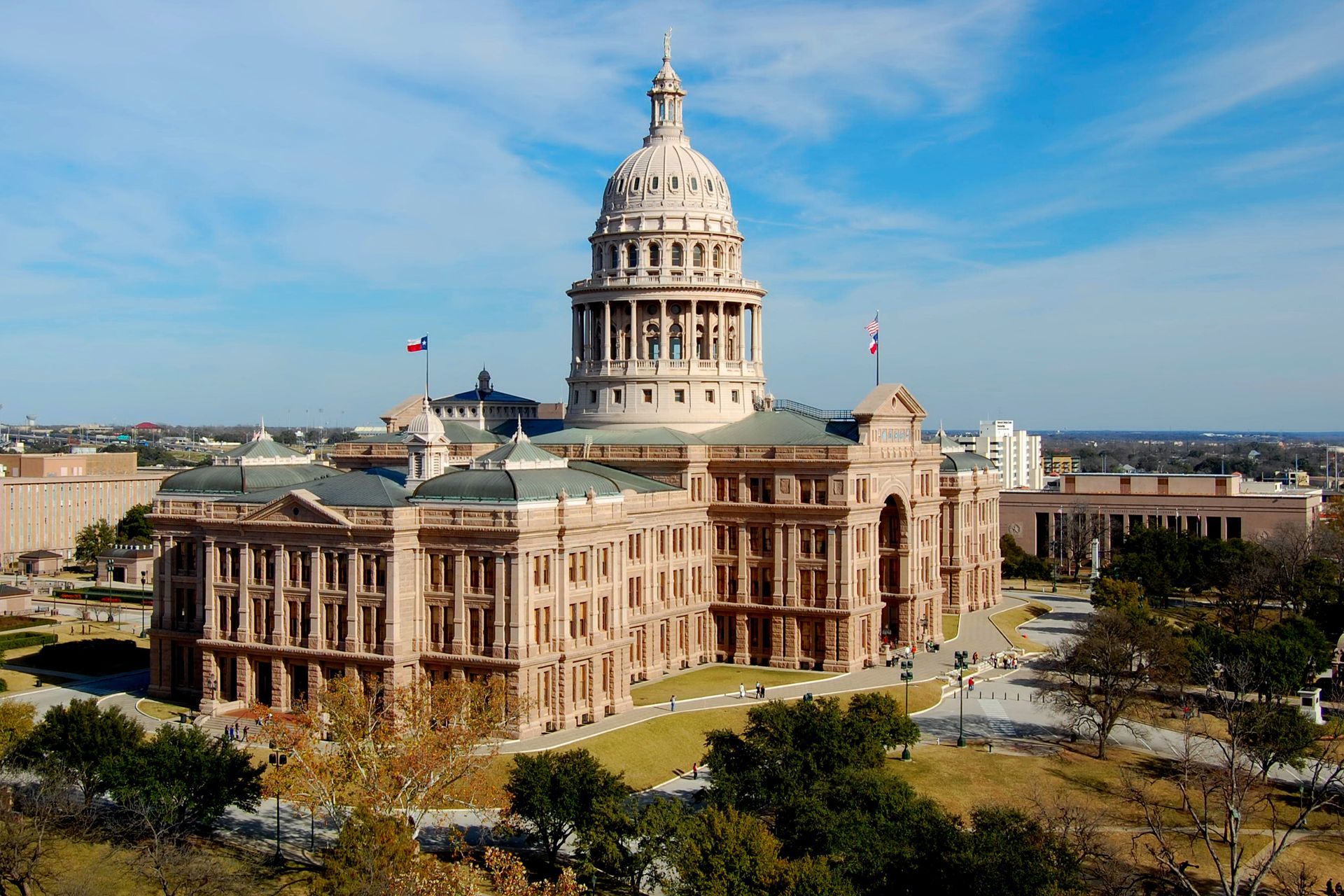 The Texas State Capitol building with its impressive architecture and lush grounds.