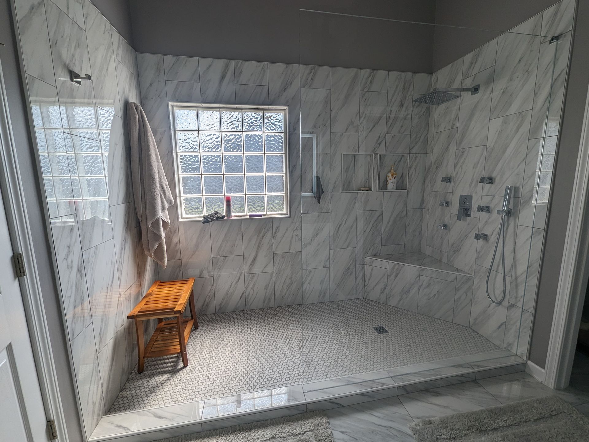 Massive walk-in shower with dual heads.