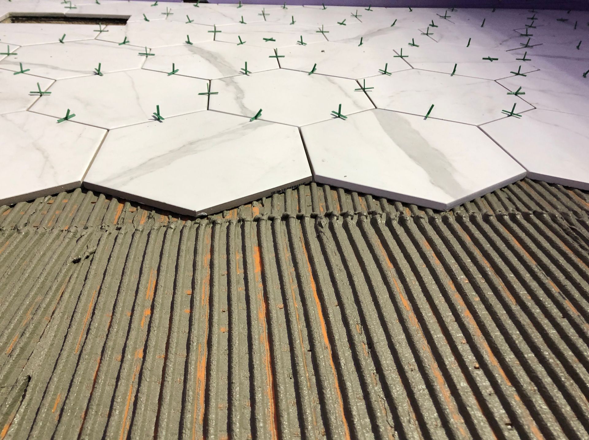 A roof with a lot of green crosses on it