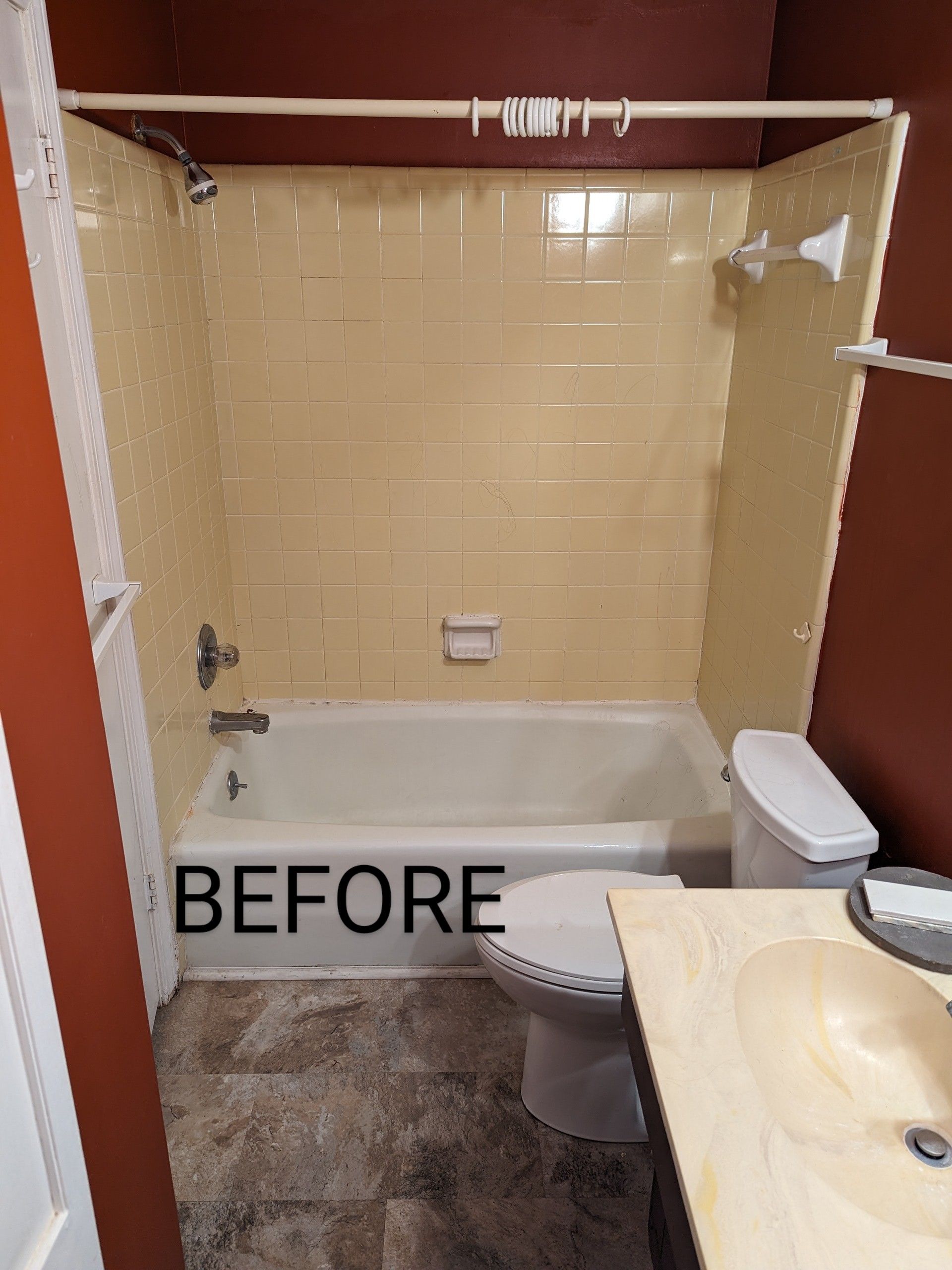 A bathroom with a tub , toilet , sink and shower.