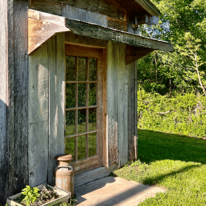 A small wooden building with a sign that says chill house