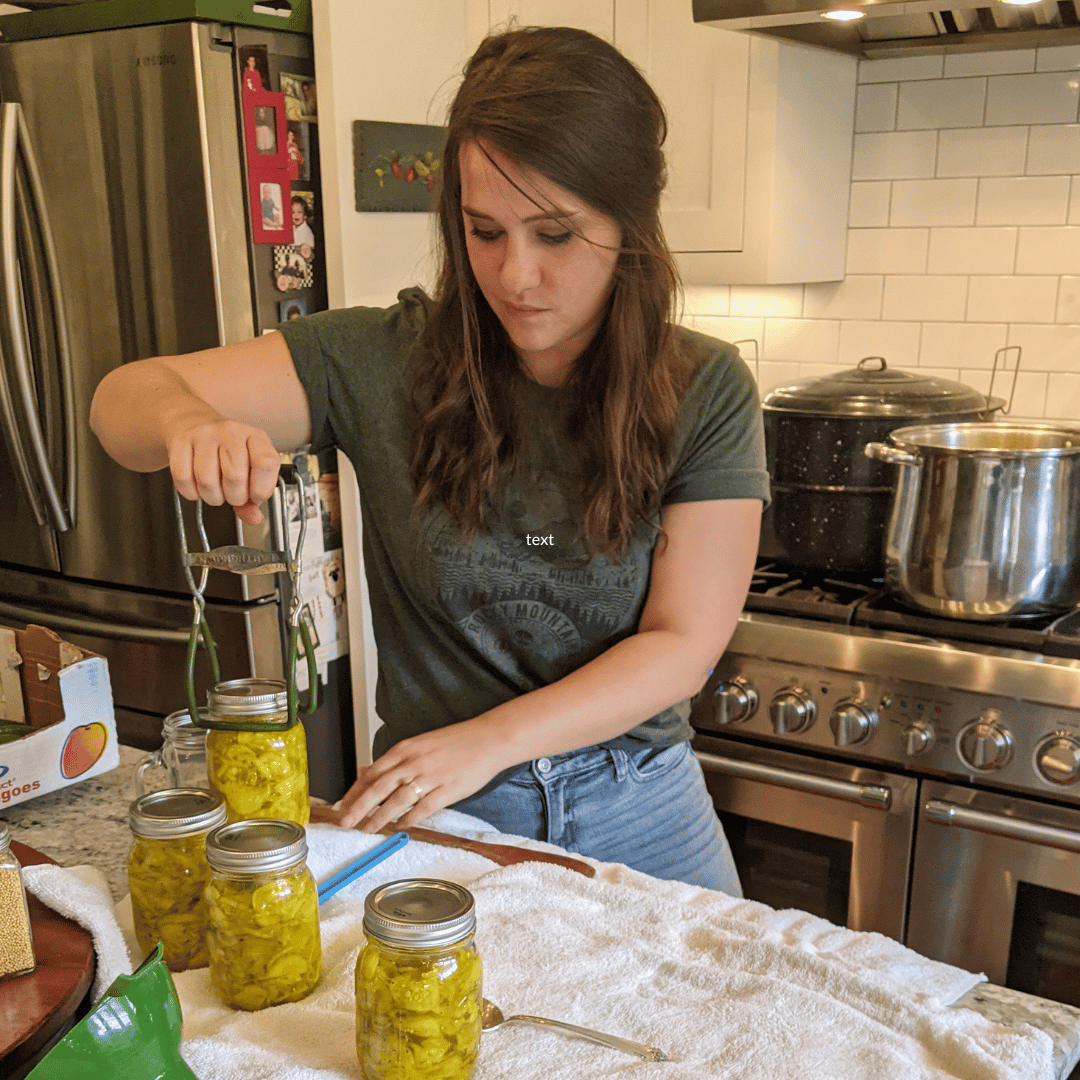 woman in a kitchen canning 