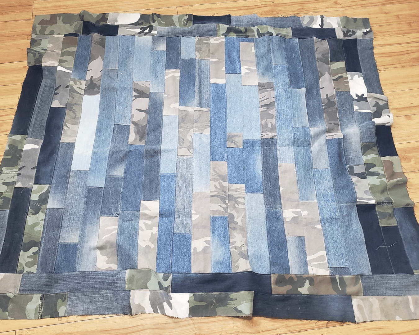 quilt made from strips of jeans and clothing