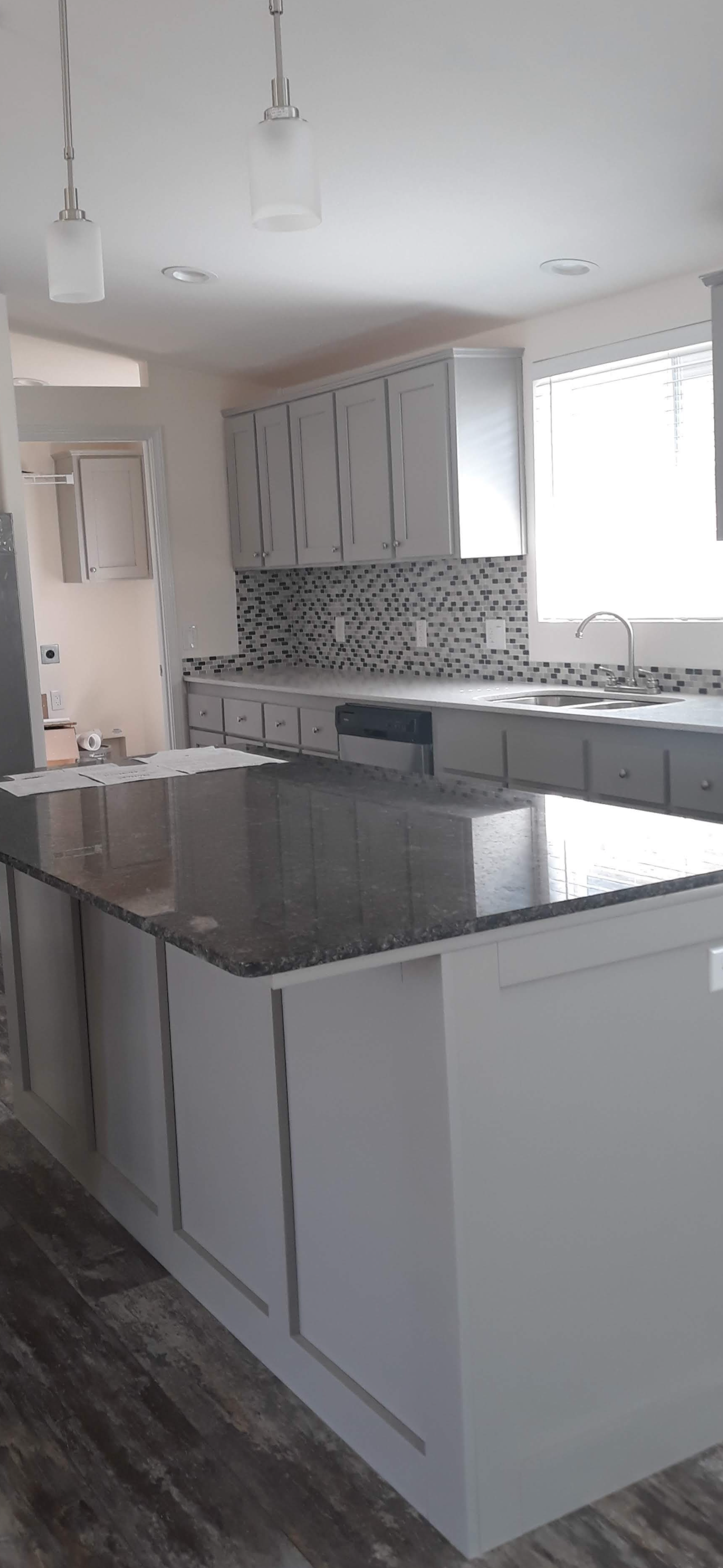 There is a large island in the middle of the kitchen.