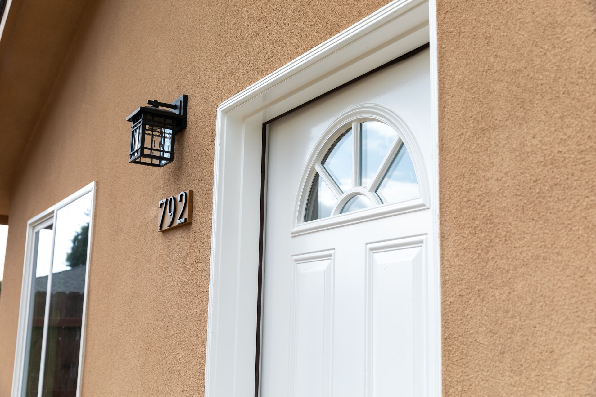The front door of a house with the number 293 on it