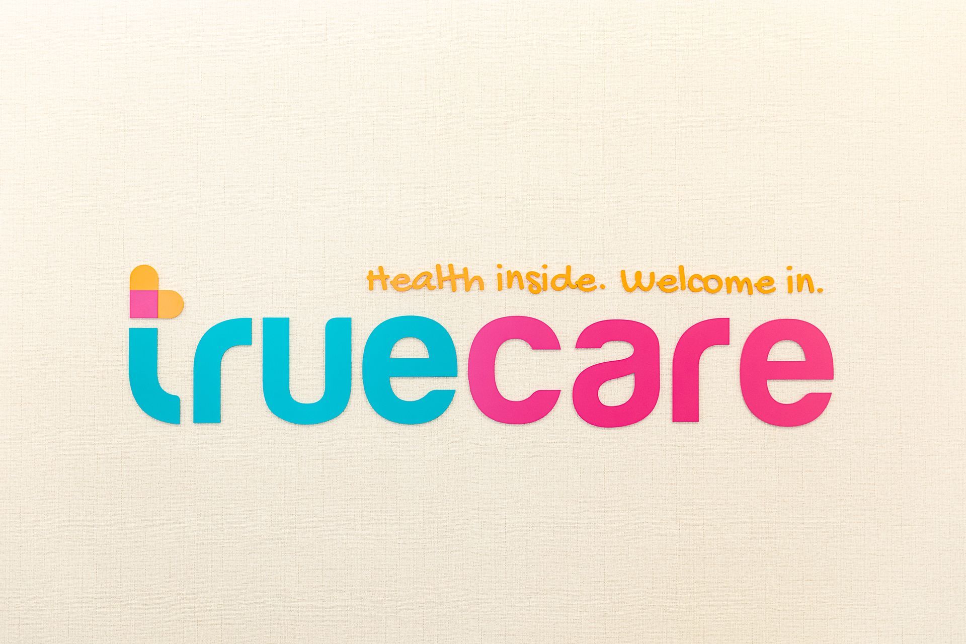 A logo for truecare health inside welcome in