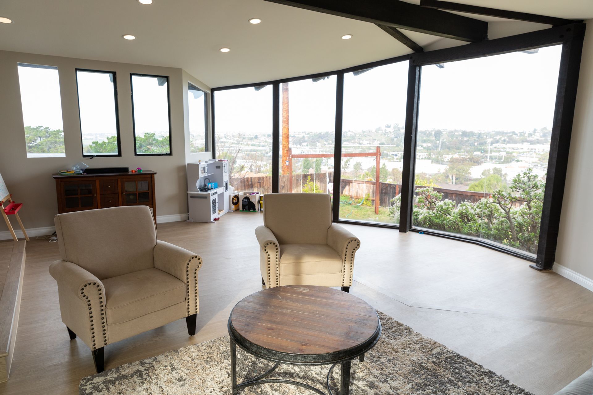 A living room with two chairs and a coffee table