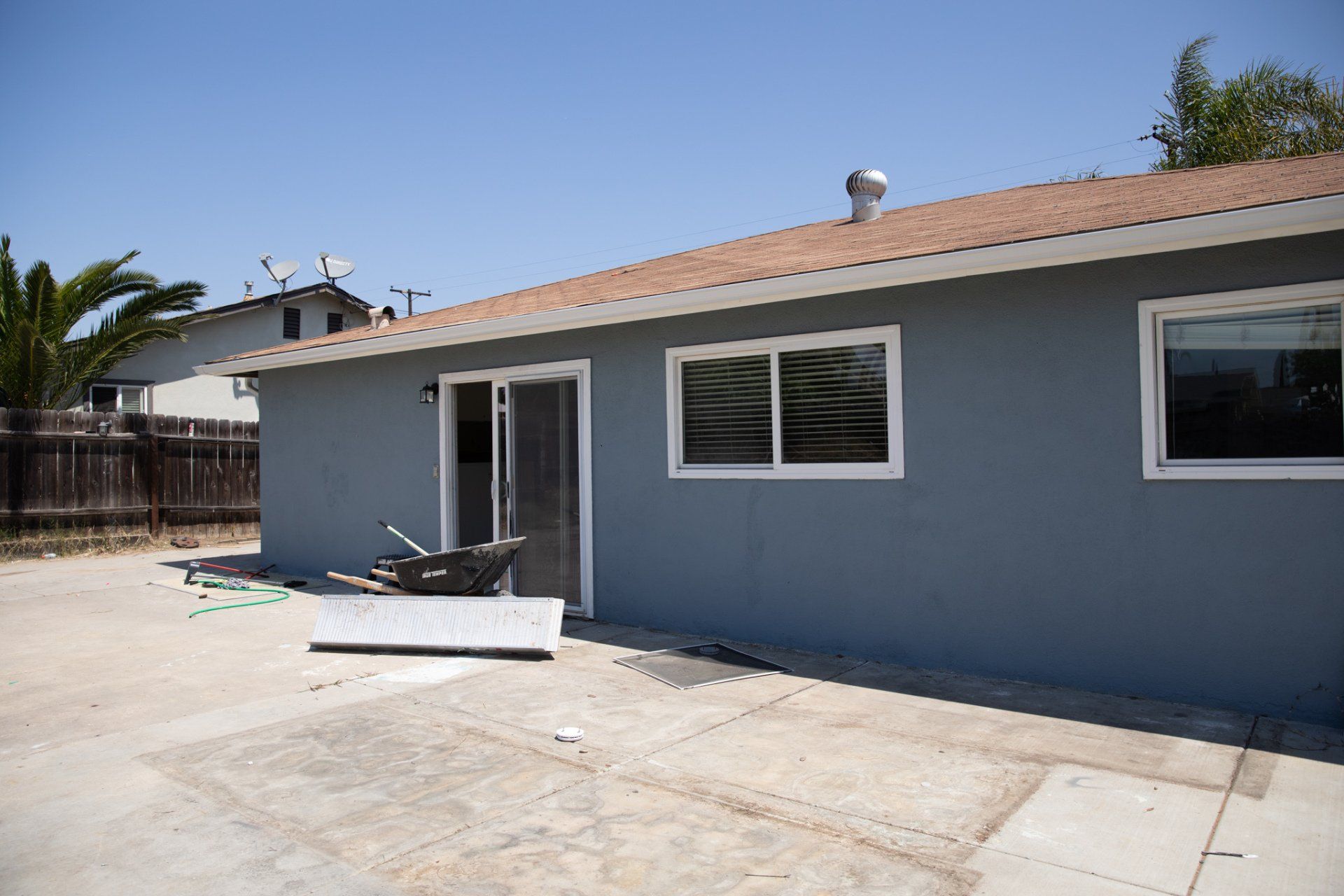 A house with a lot of windows and a sliding glass door