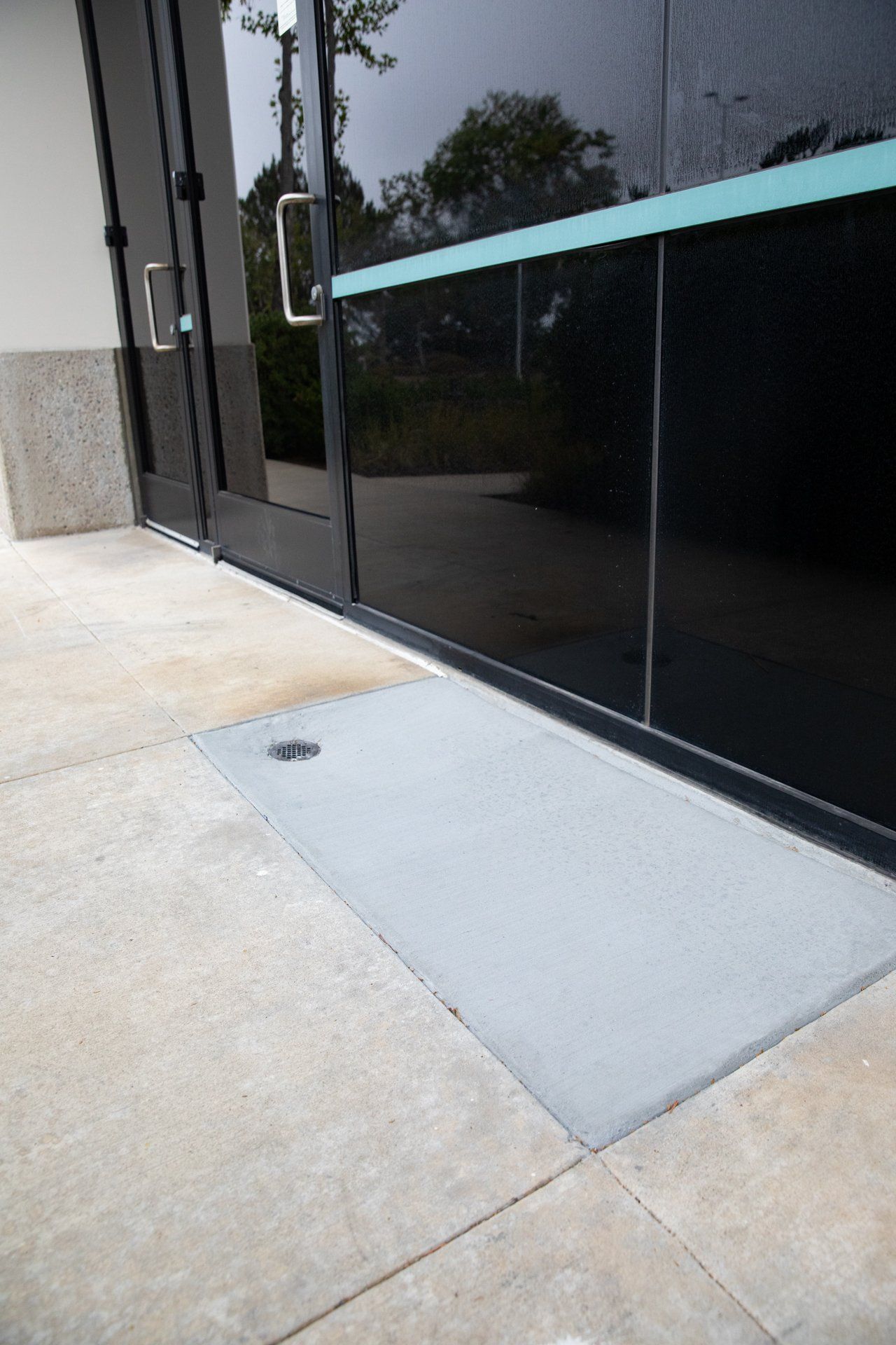 A black door with a green stripe on the side of it