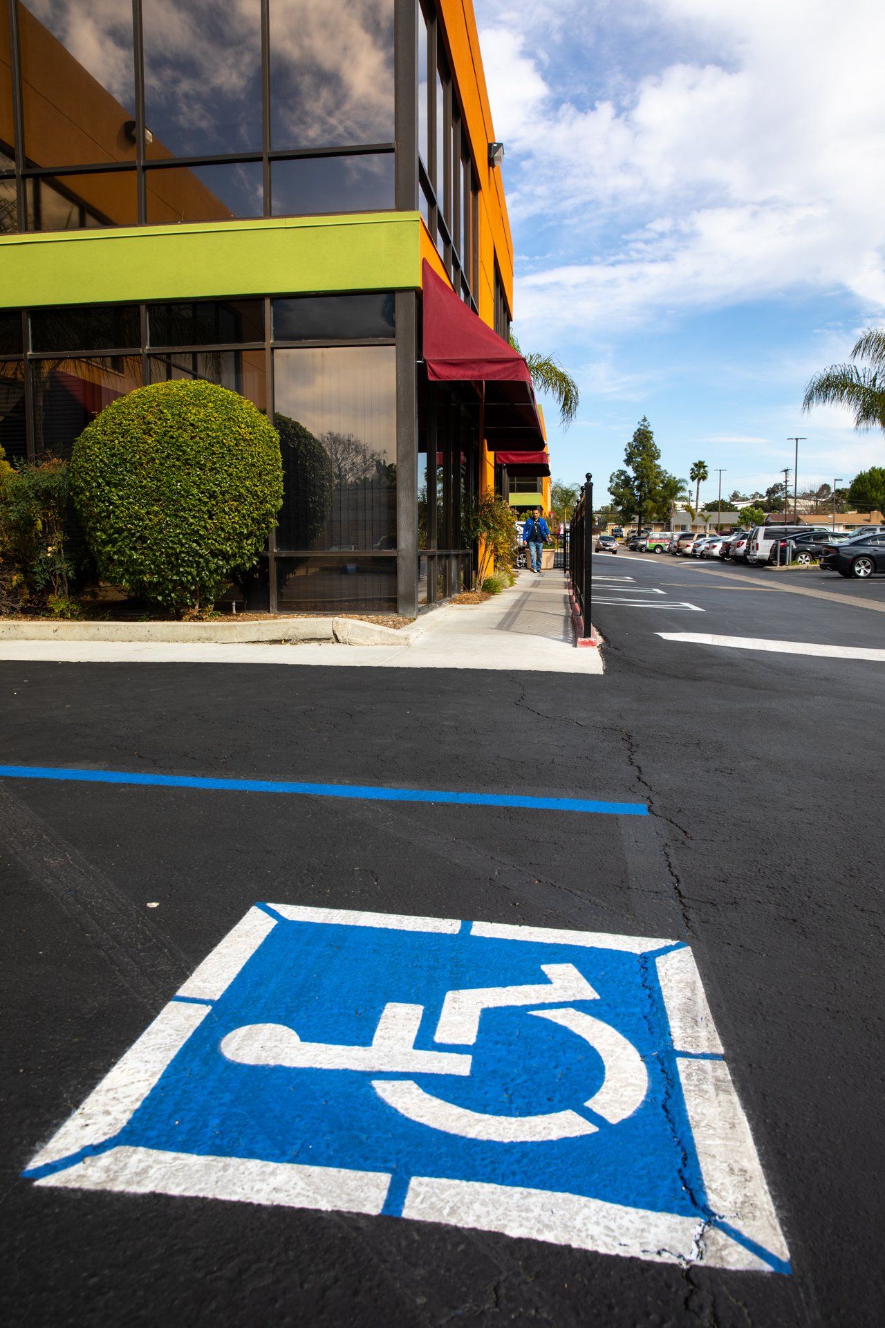 A handicapped parking spot in front of a building