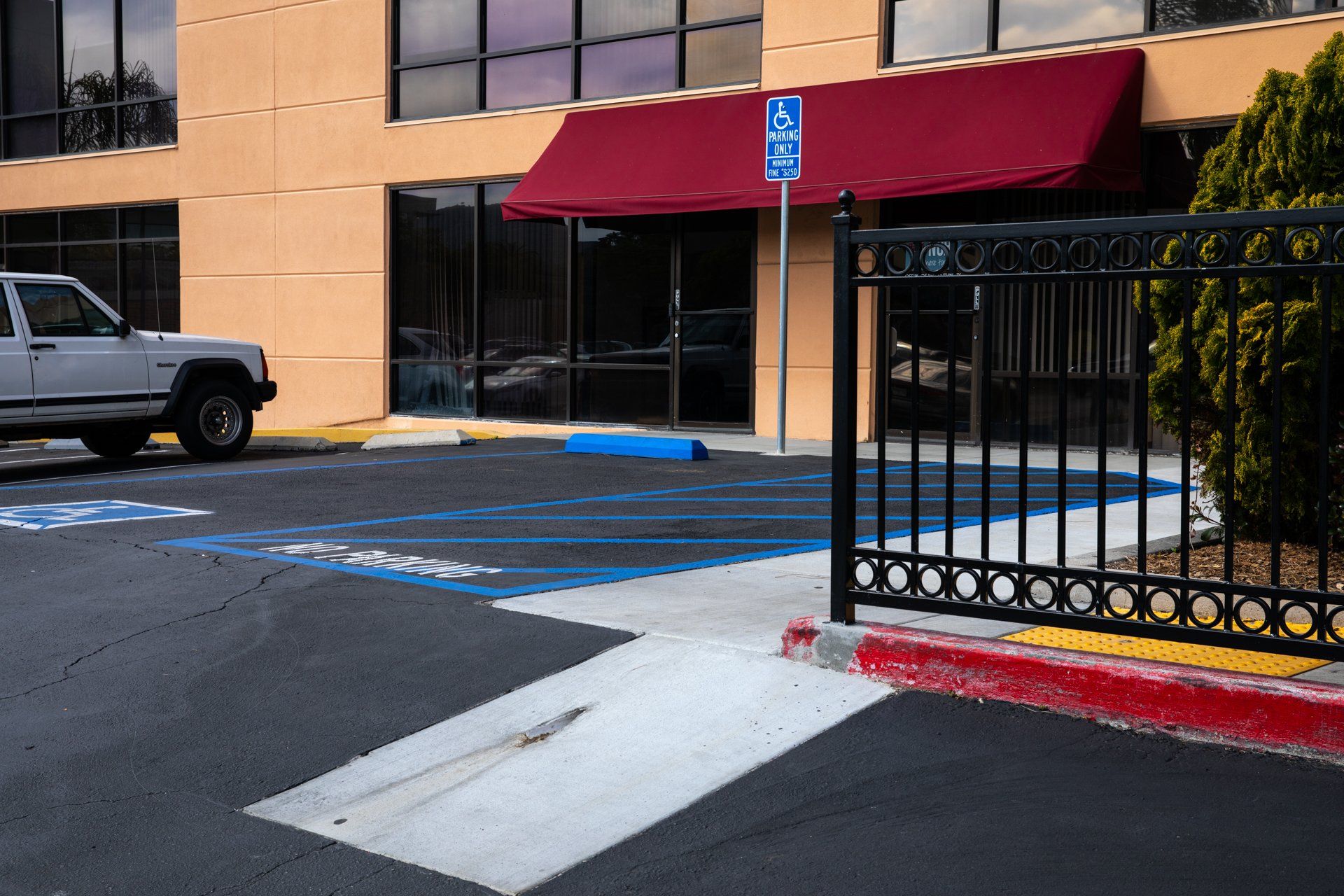 A handicapped parking spot in front of a building