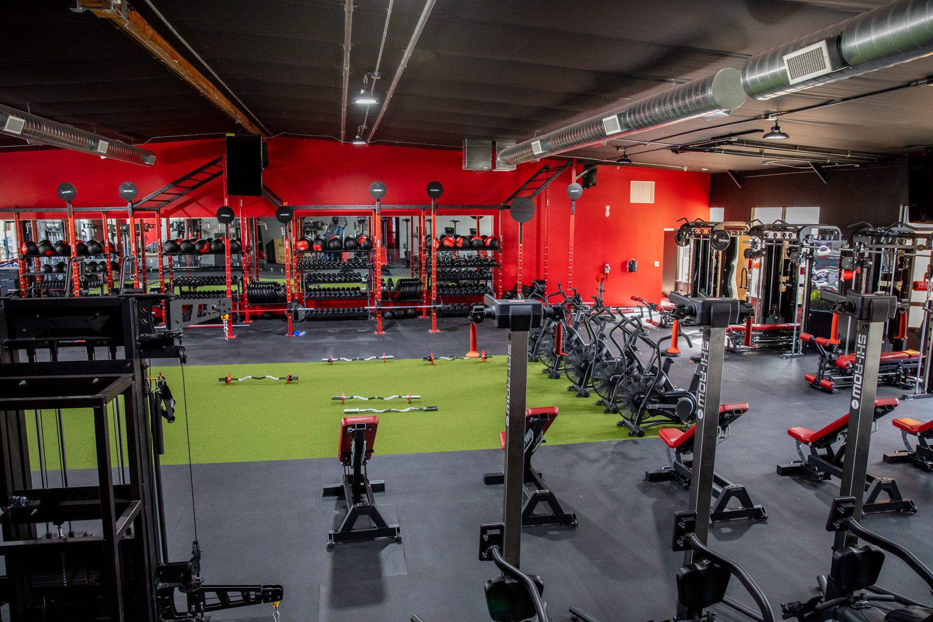 A large gym with a lot of exercise equipment