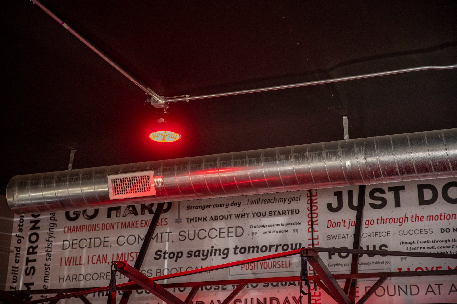 A ceiling with a sign that says `` just do '' on it.