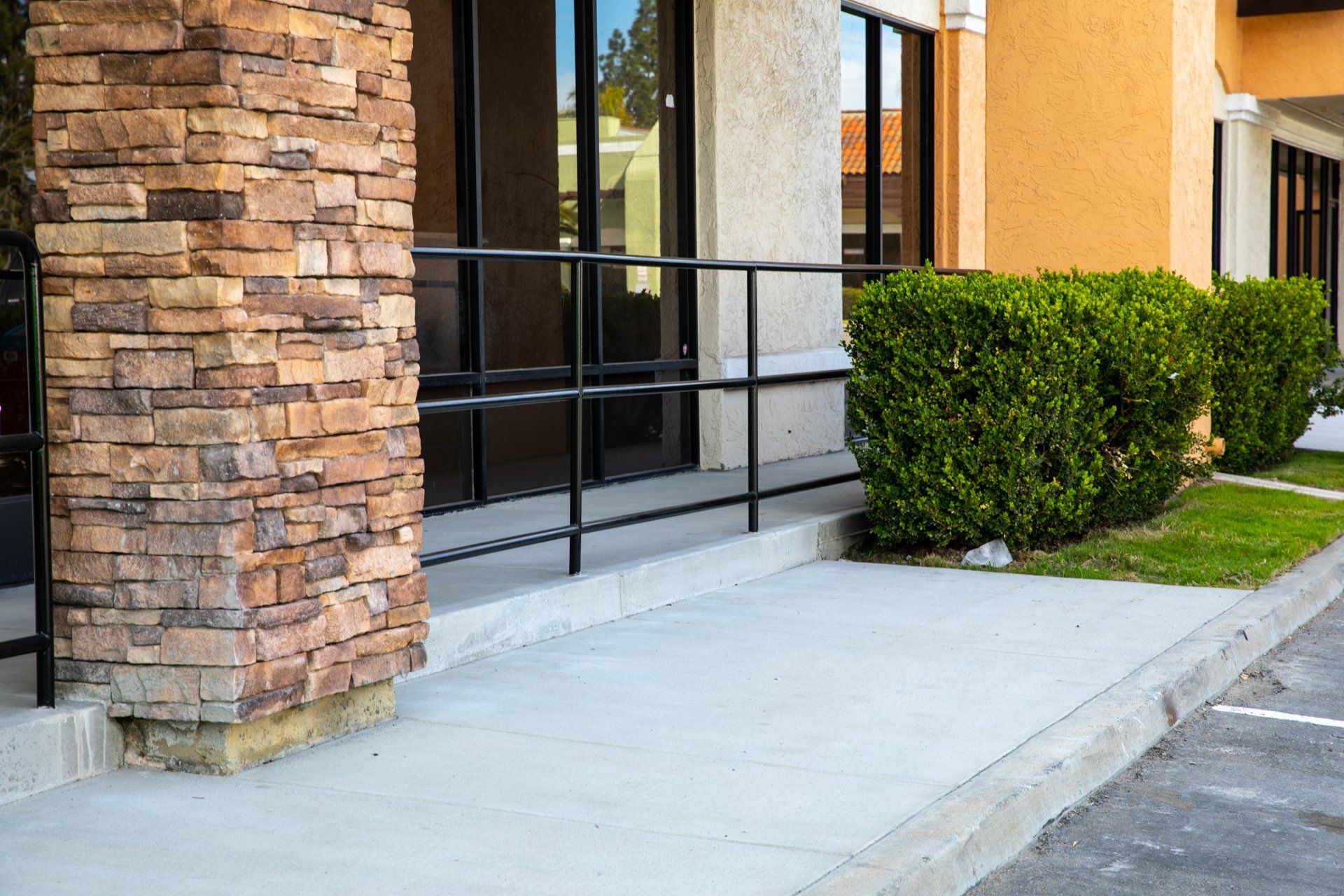 A brick building with a ramp leading to it