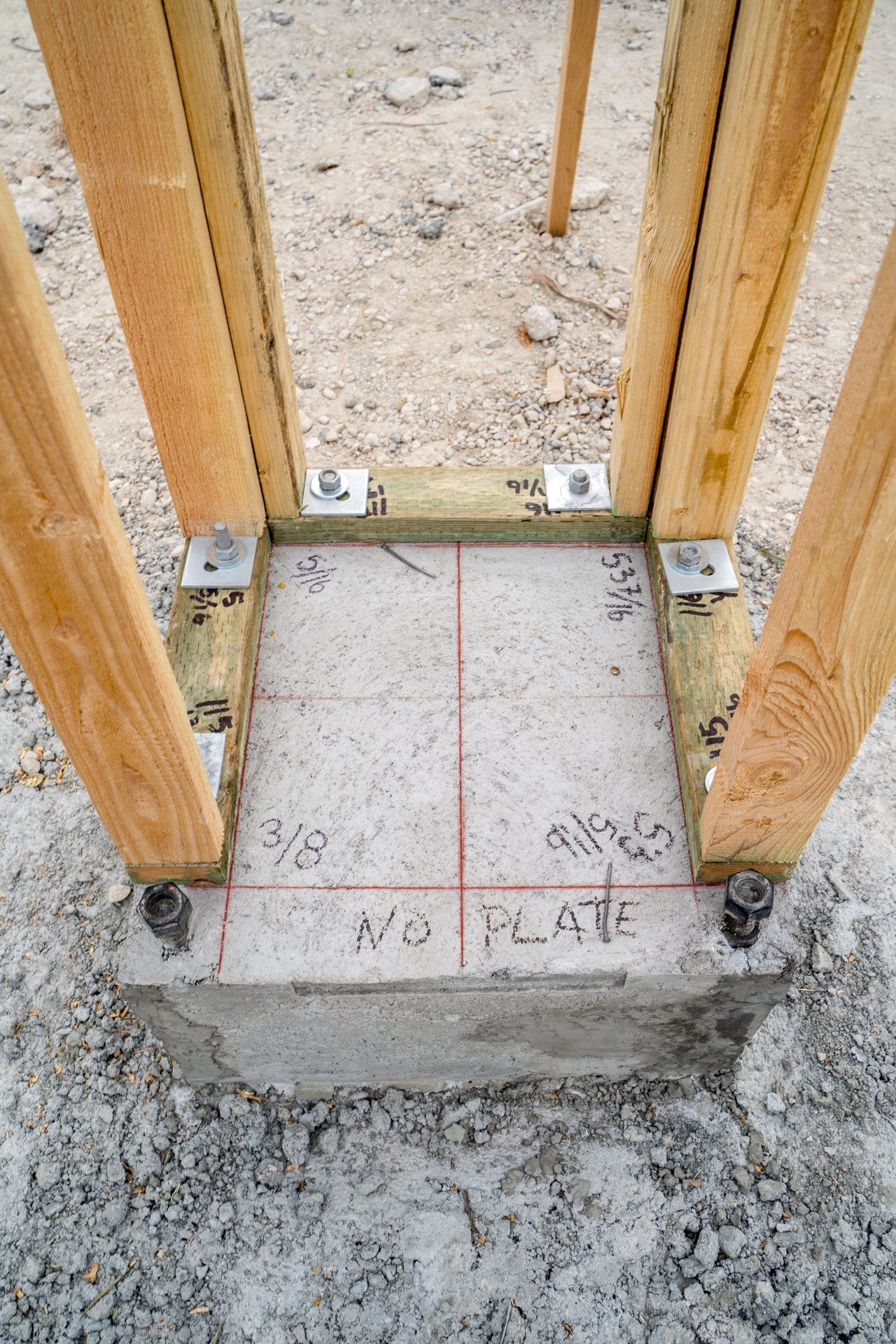 A wooden frame is sitting on top of a concrete base.