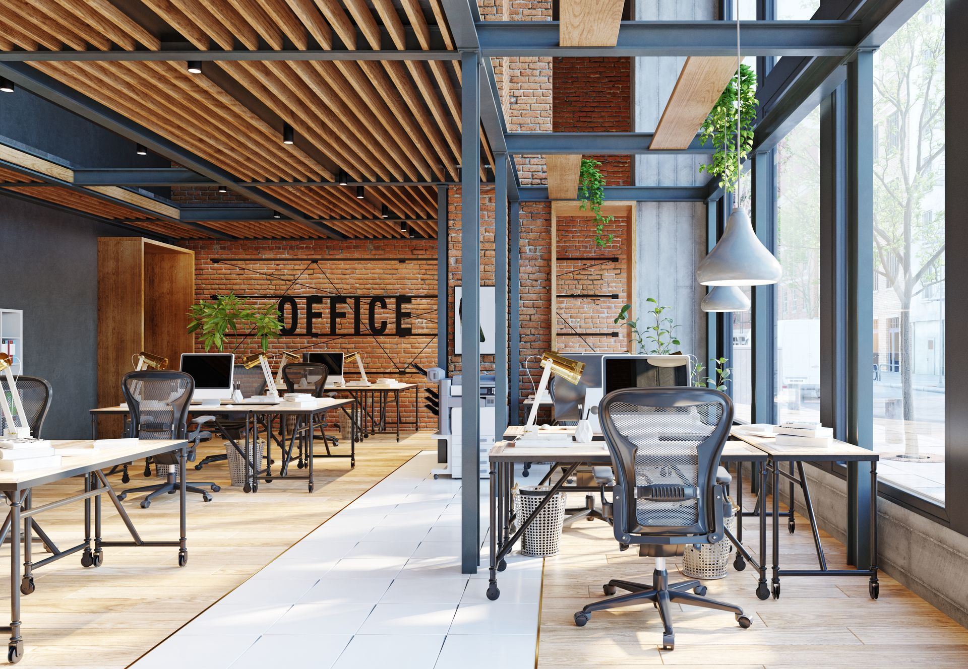 A modern office with lots of desks and chairs.