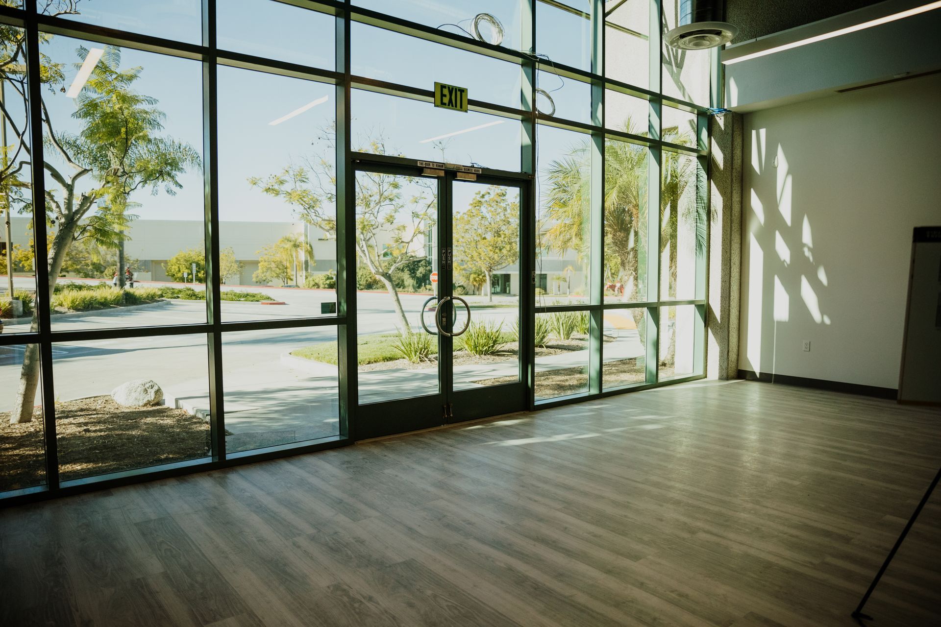 An empty room with a lot of windows and doors.