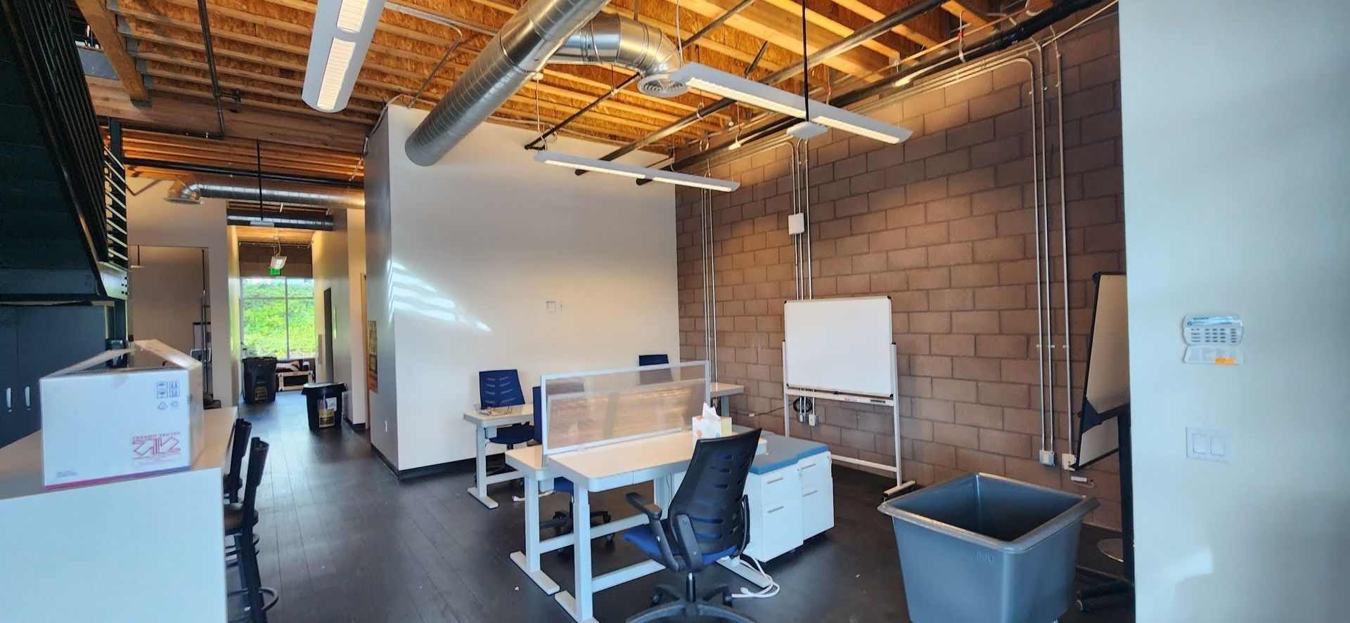 A room with a white board that says ' a ' on it