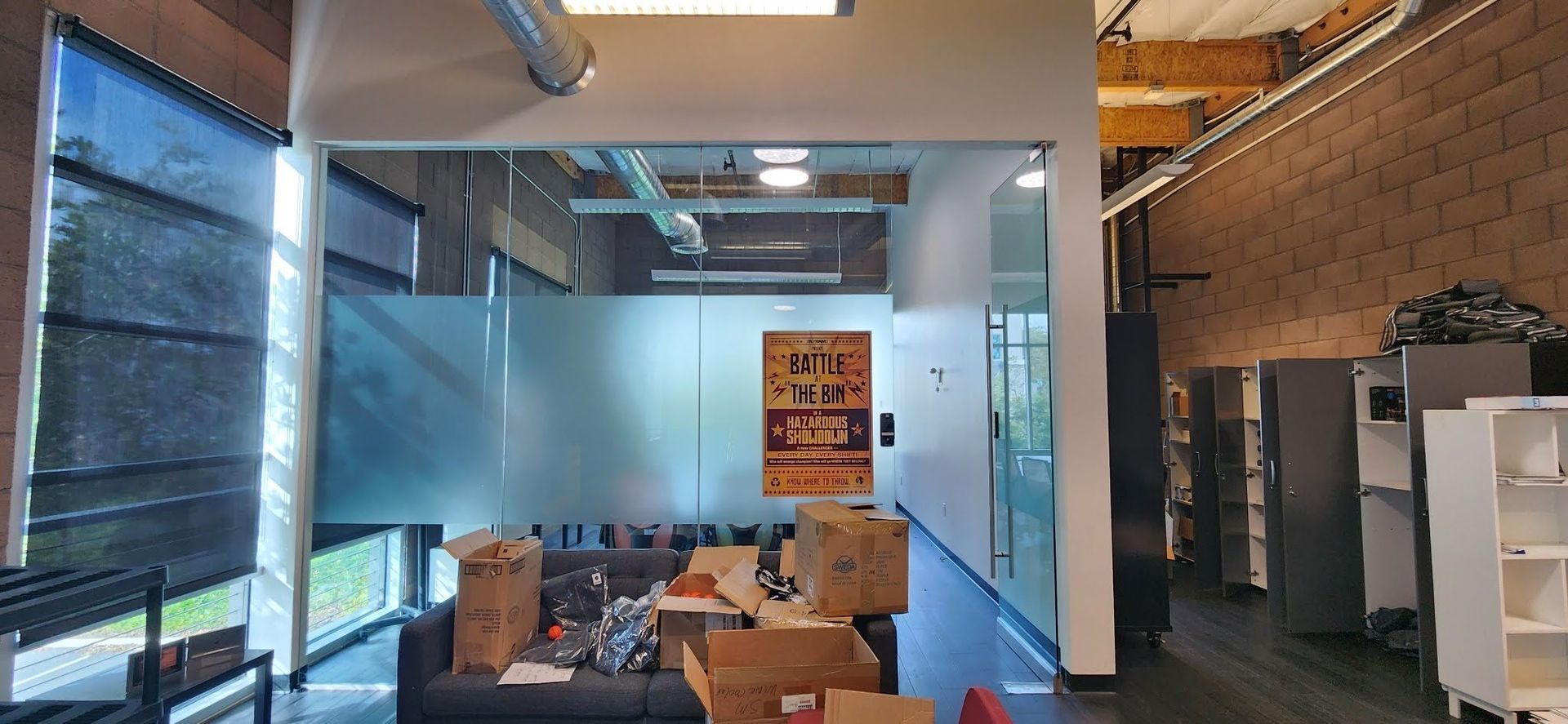 A room with a couch and boxes in it