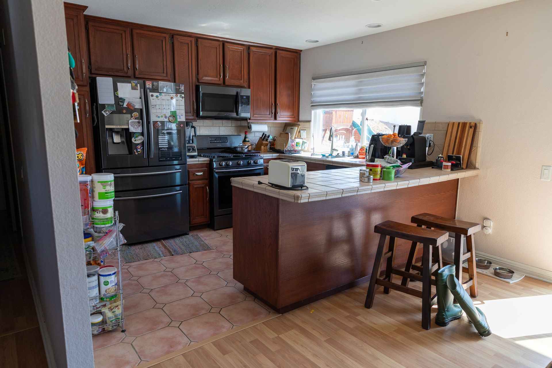 A kitchen with a large island and stools