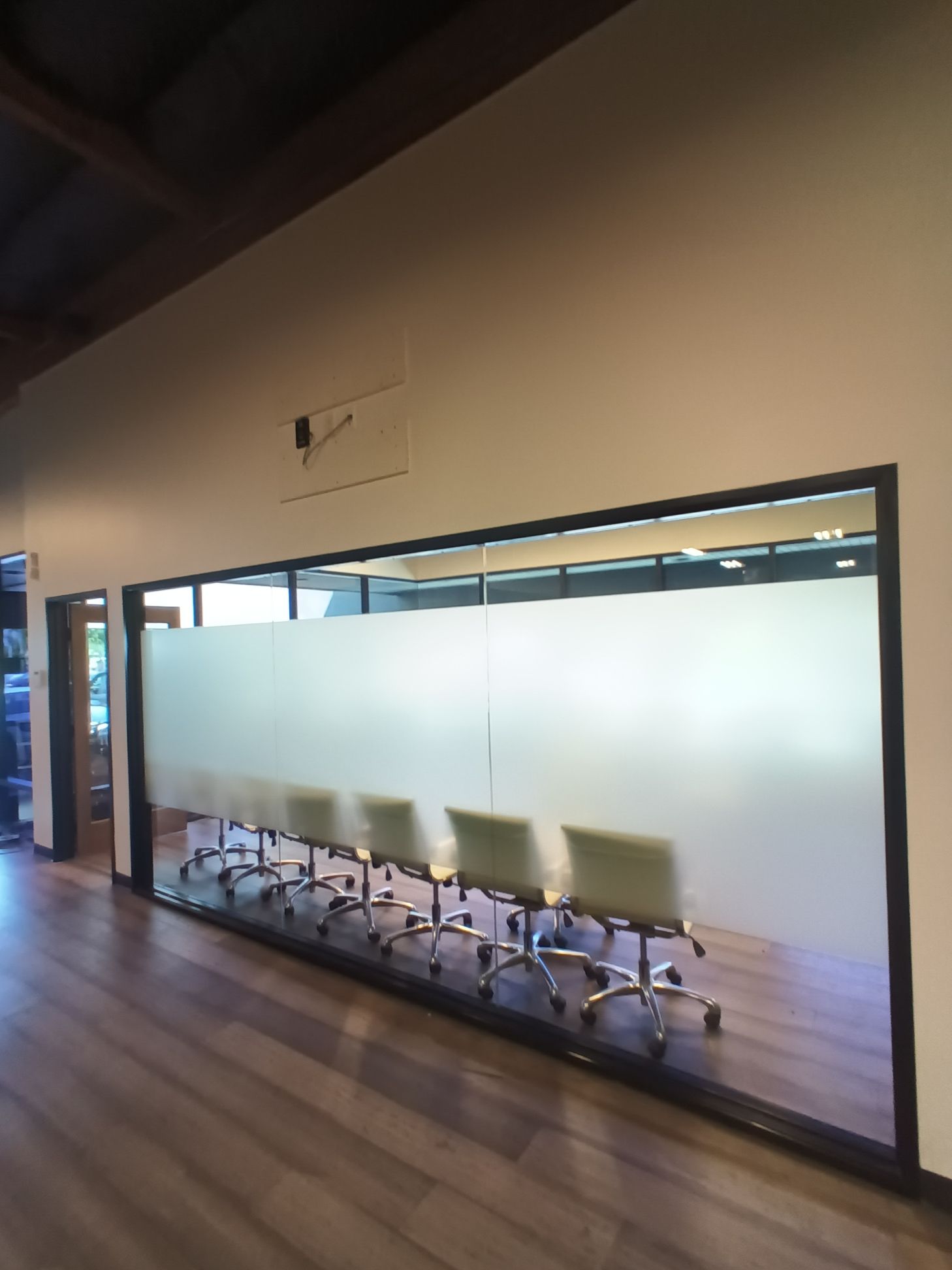 A conference room with a long table and chairs