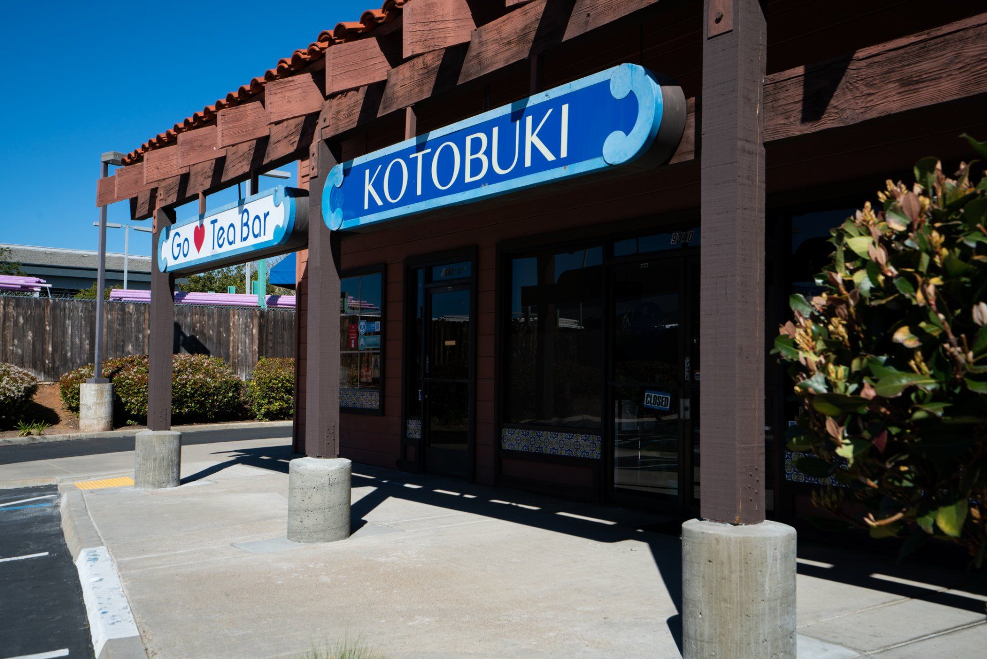 A store front with a sign that says ' kotobuki ' on it